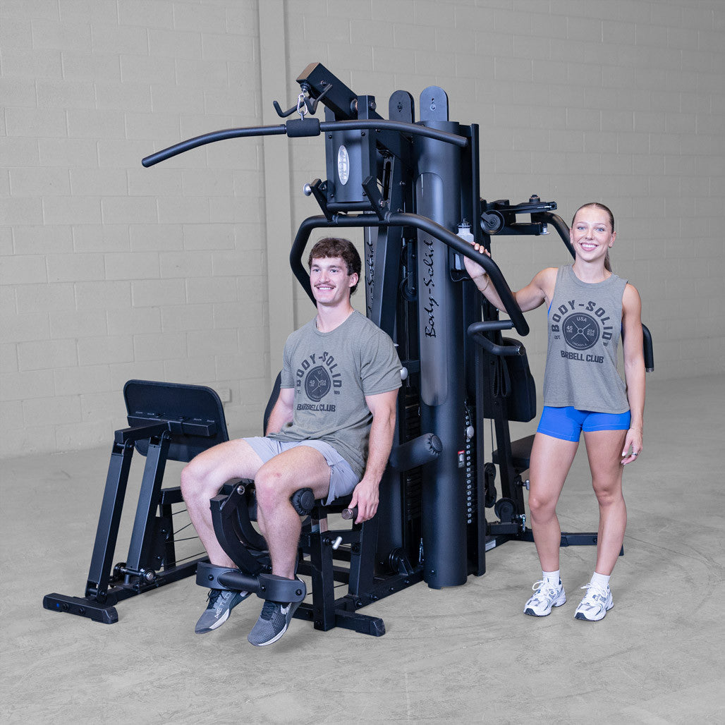Man and woman posing next to the Body-Solid G9B Multi-Station Gym