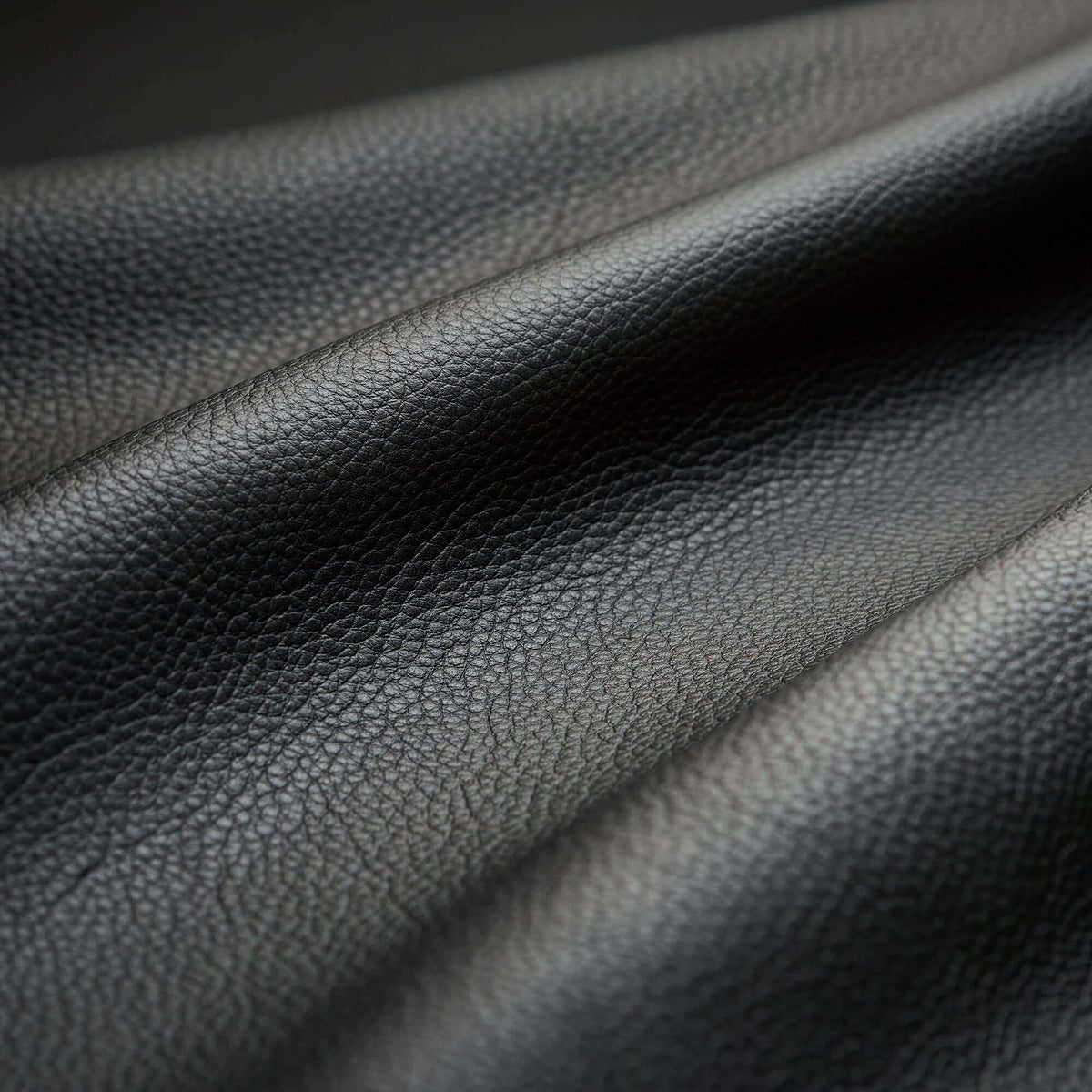 Close-up of black leather texture on massage chair