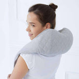 Quzy Cordless Heated Massager on woman's neck