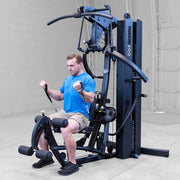 Body Solid Fusion 600 gym in use for seated exercises