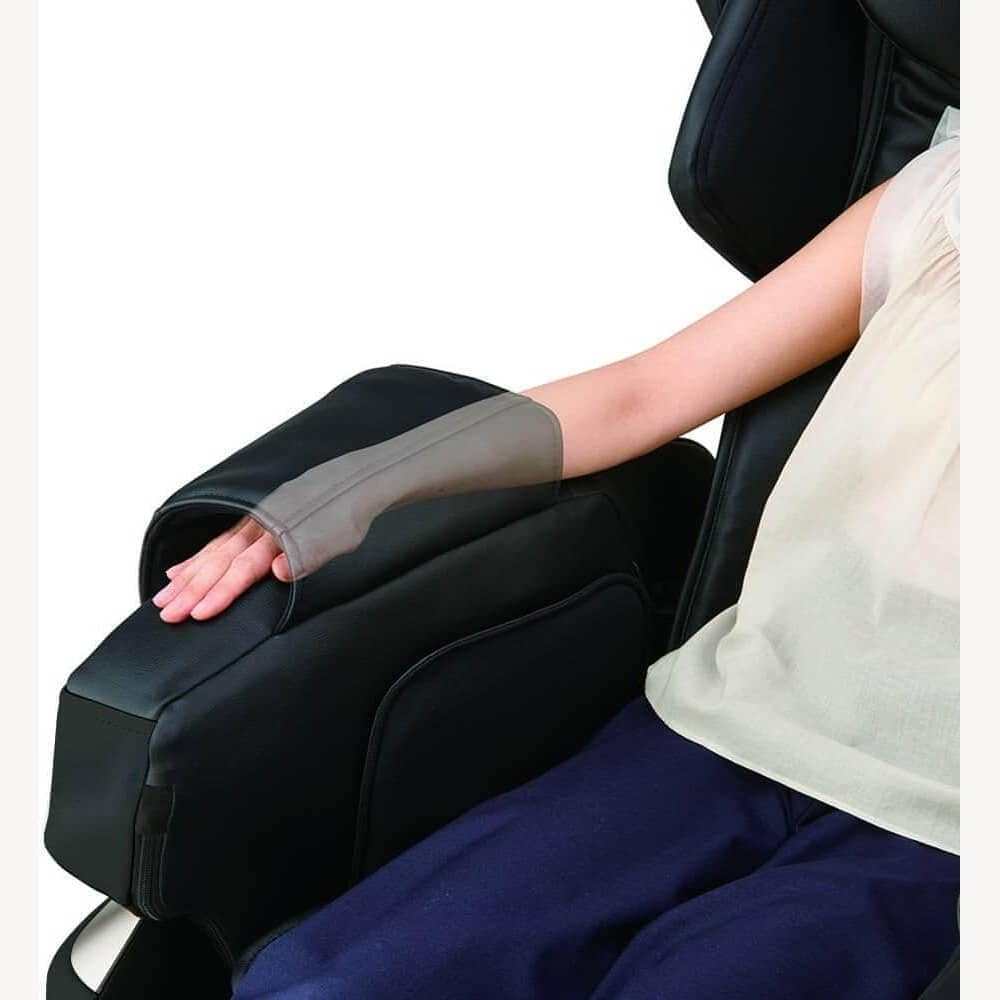 Kurodo Massage Chair armrest with person using arm massage feature