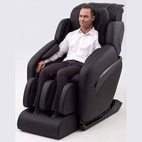 Jin 1.0 Massage Chair in black leather with person relaxing
