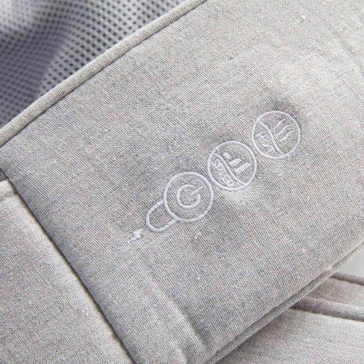 Quzy Cordless Heated Massager close-up of embroidered icons