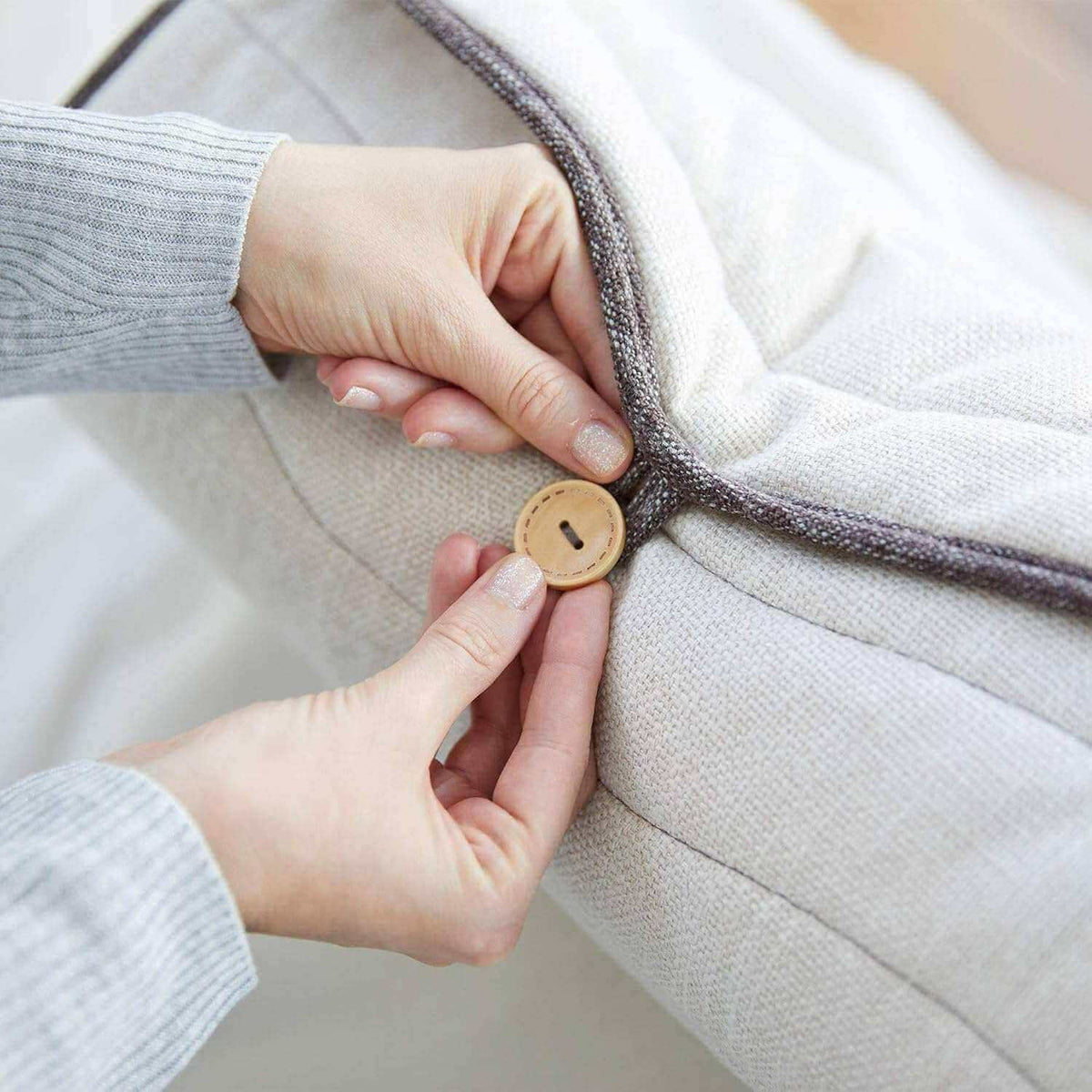 Corron Roll-Up Massage Cushion button fastening close-up