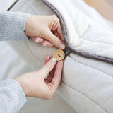 Corron Roll-Up Massage Cushion button fastening close-up