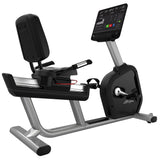 Arctic Silver Aspire recumbent bike in three-quarter view with a reclined backrest seat, side handrails, and the SL Console on its mast