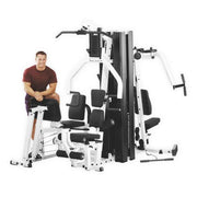 Body-Solid EXM3000LPS gym with user seated