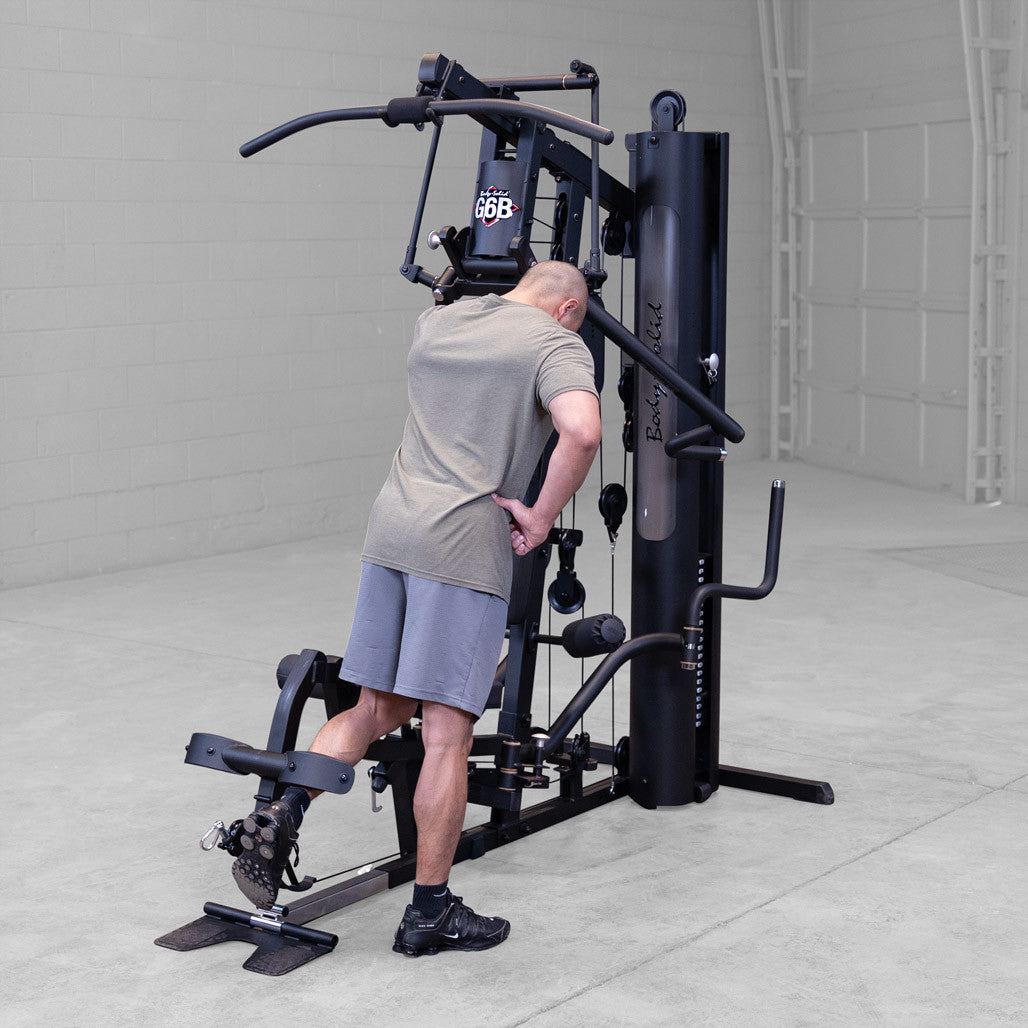 Body-Solid G6B Bi-Angular gym — leg developer in use