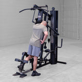 Body-Solid G6B Bi-Angular gym — leg developer in use