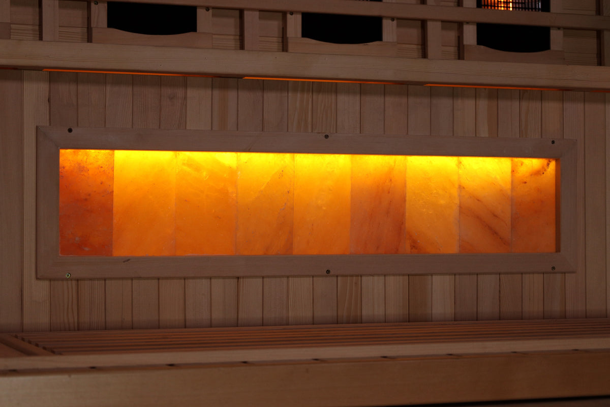 Backlit Himalayan salt bar glowing amber below the bench