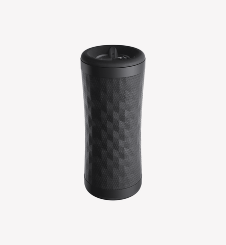 Black contoured vibration roller standing upright with a textured diamond grip surface